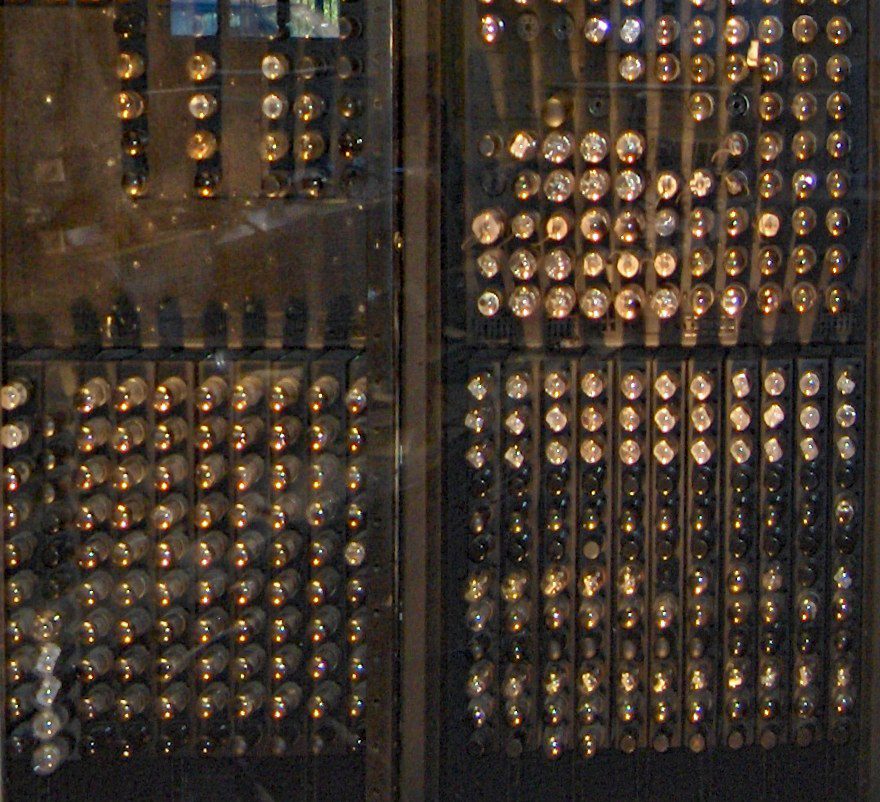 Close-up of the back of an ENIAC panel: rows of glass vacuum tubes in their sockets