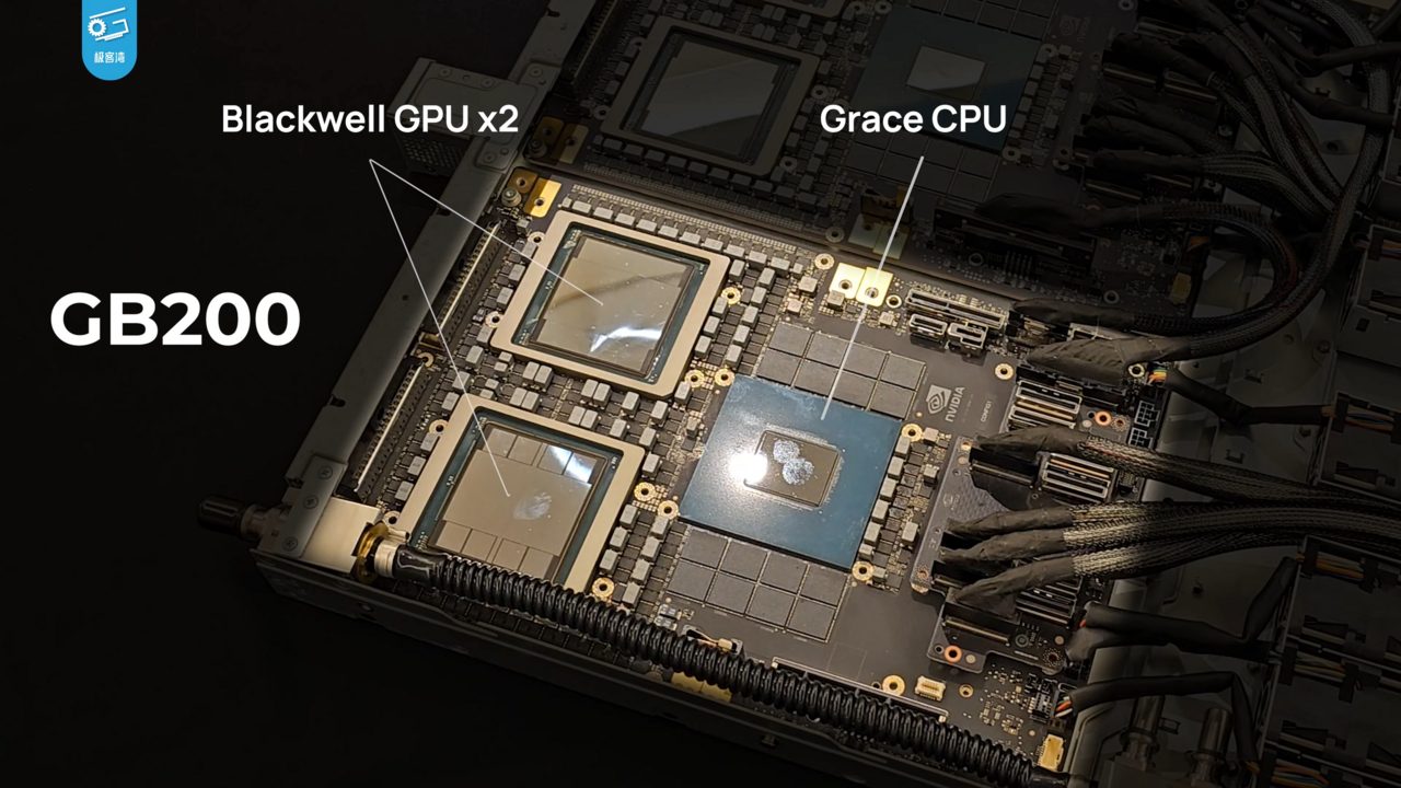 A GB200 compute board with its cooling removed, labelled in the video it comes from: two large Blackwell GPU packages and a Grace CPU package beside them