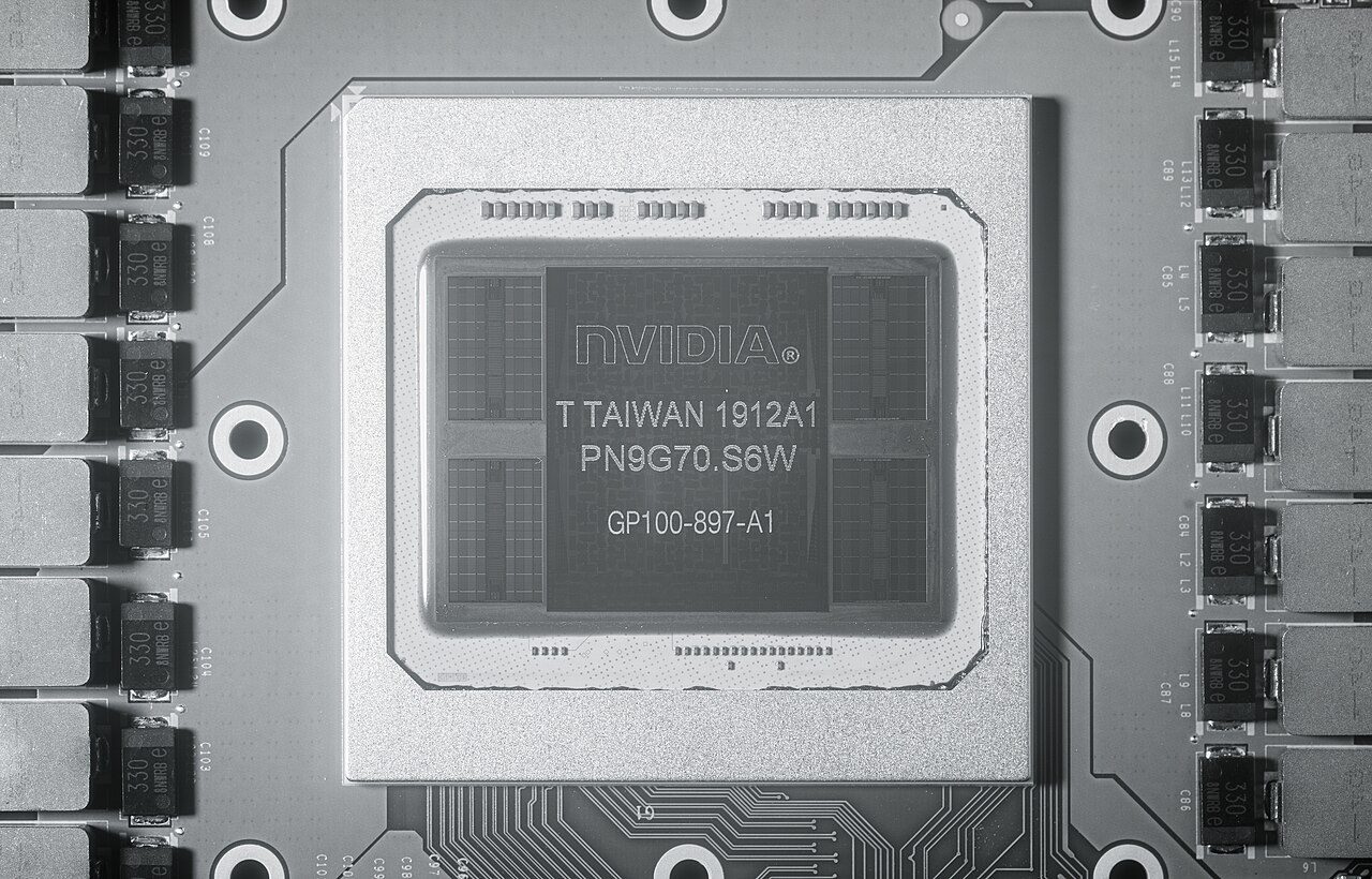Near-infrared photograph of a Tesla P100 package: the large GP100 die in the centre with two rectangular HBM2 stacks on each side, inside a metal frame, with power components on the board around it